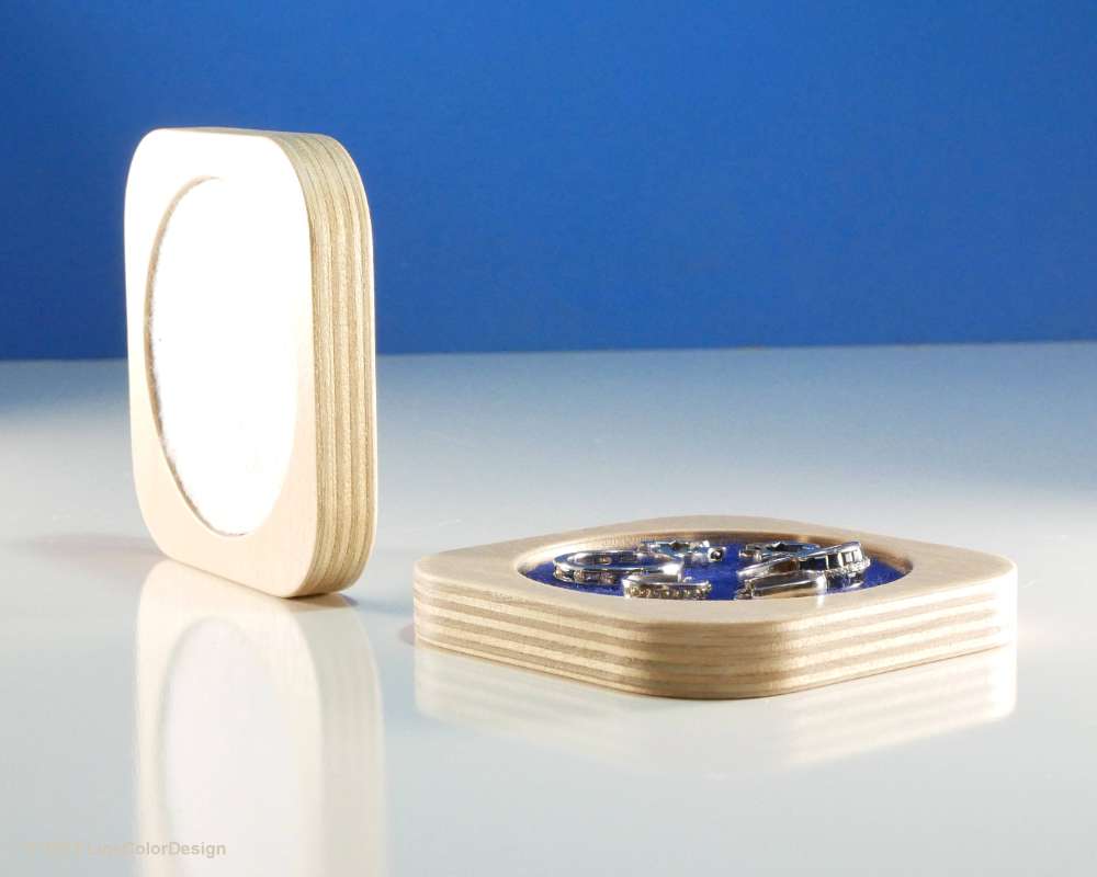 Small wood tray for small jewelry with white felt lining.  Holding earings and ring.