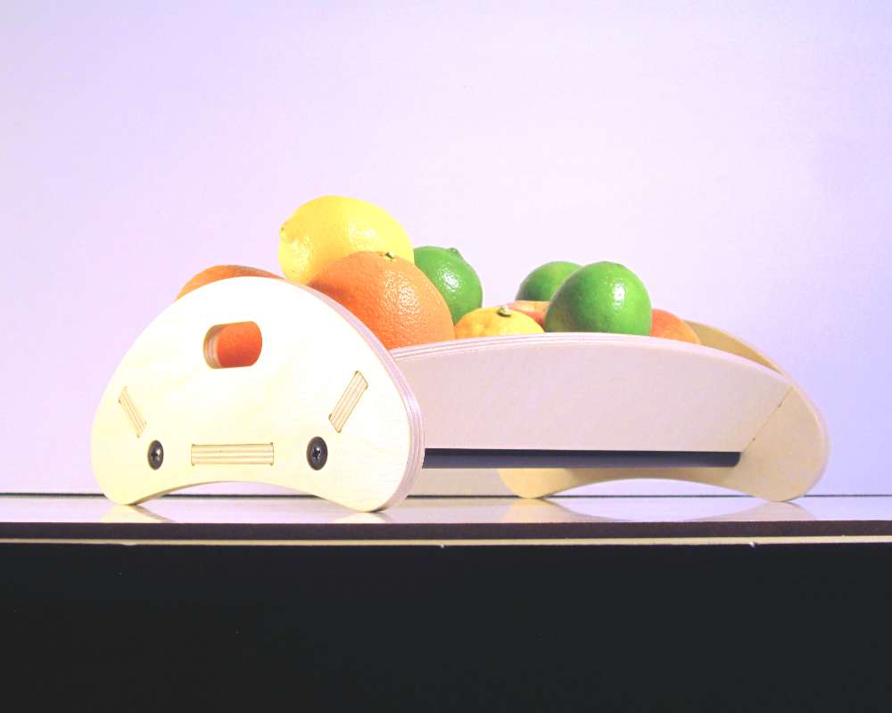 a wooden fruit bowl with curves modern lines holding fruits
