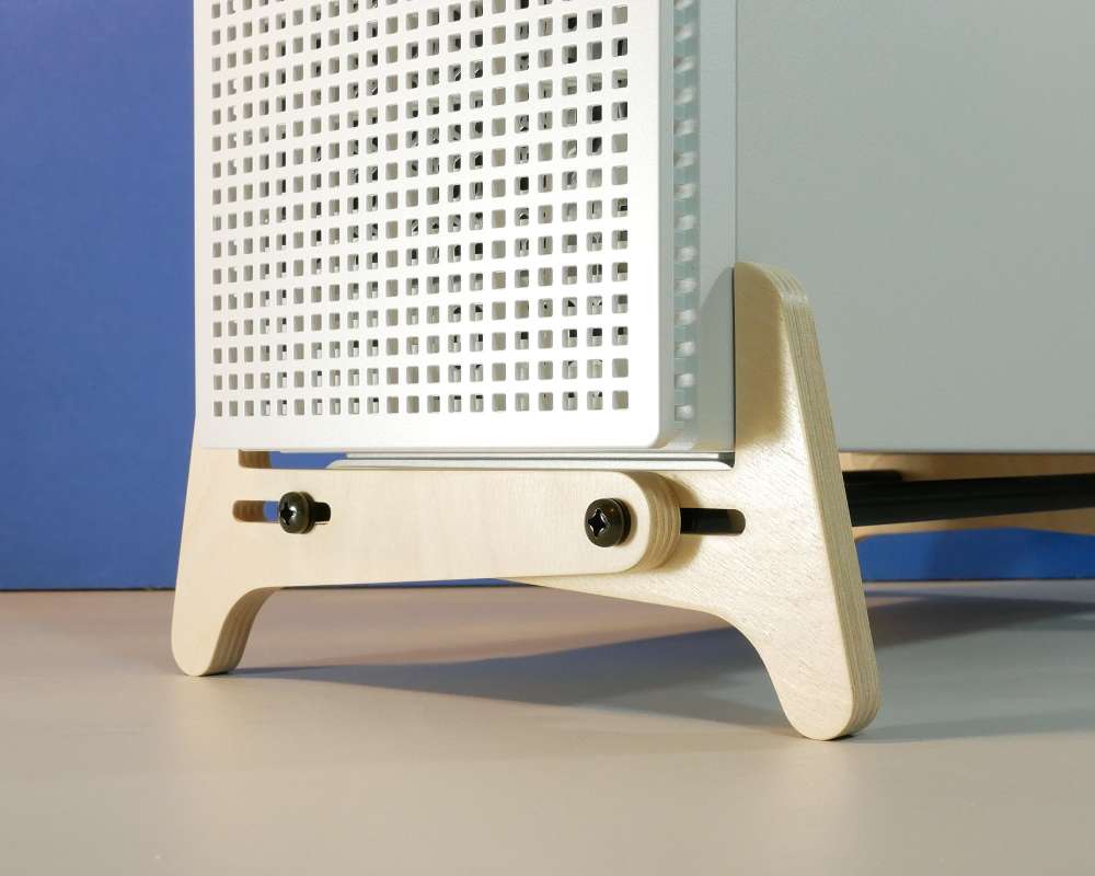 a short stand holding a PC computer tower