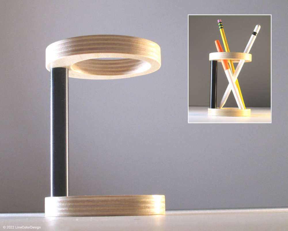 a modern pen and pencil holder with cylindrical lines made from wood and black aluminum bar